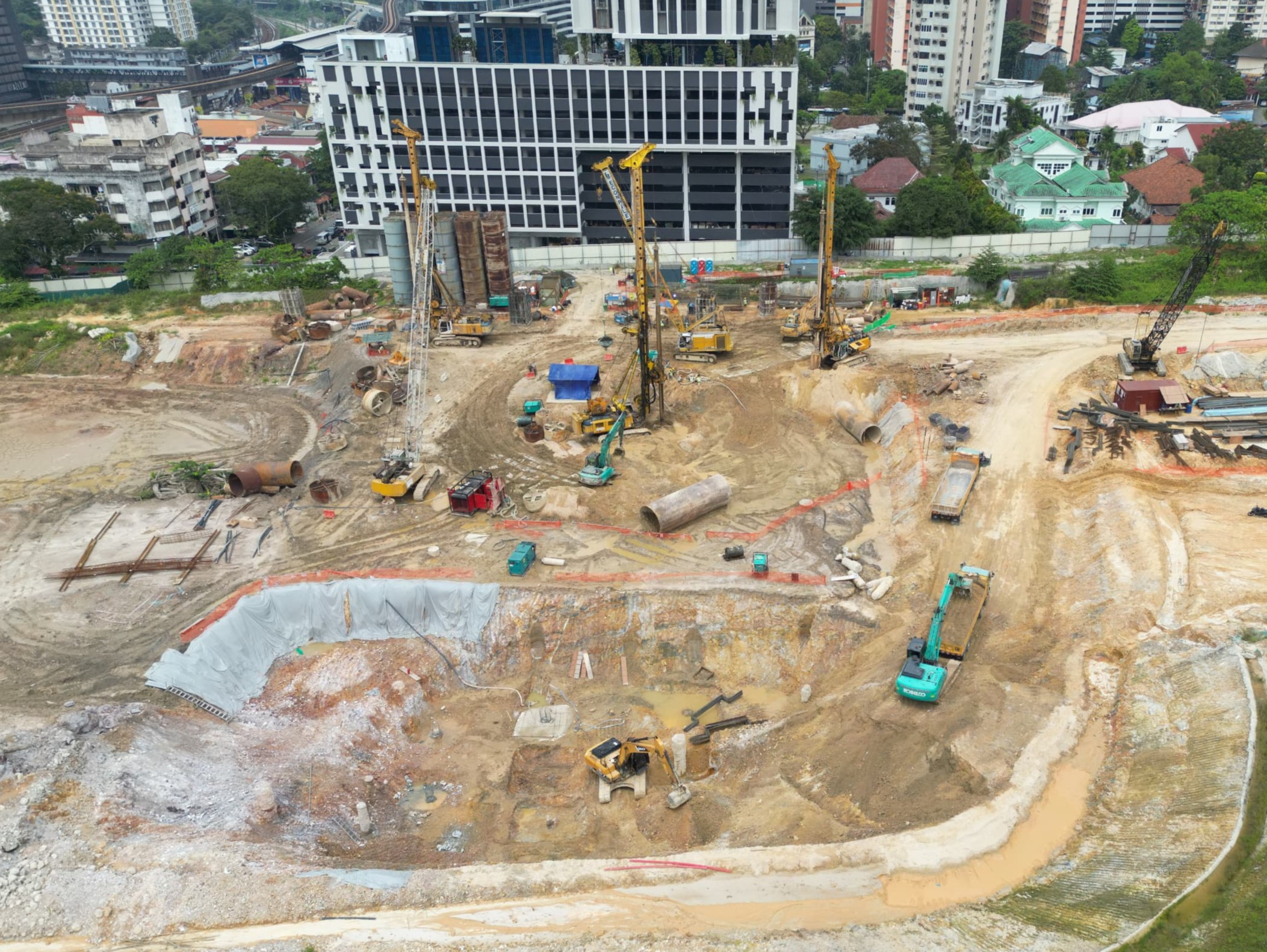 Progress as of July 2026 – Earthwork excavation for basement parking levels is in progress.